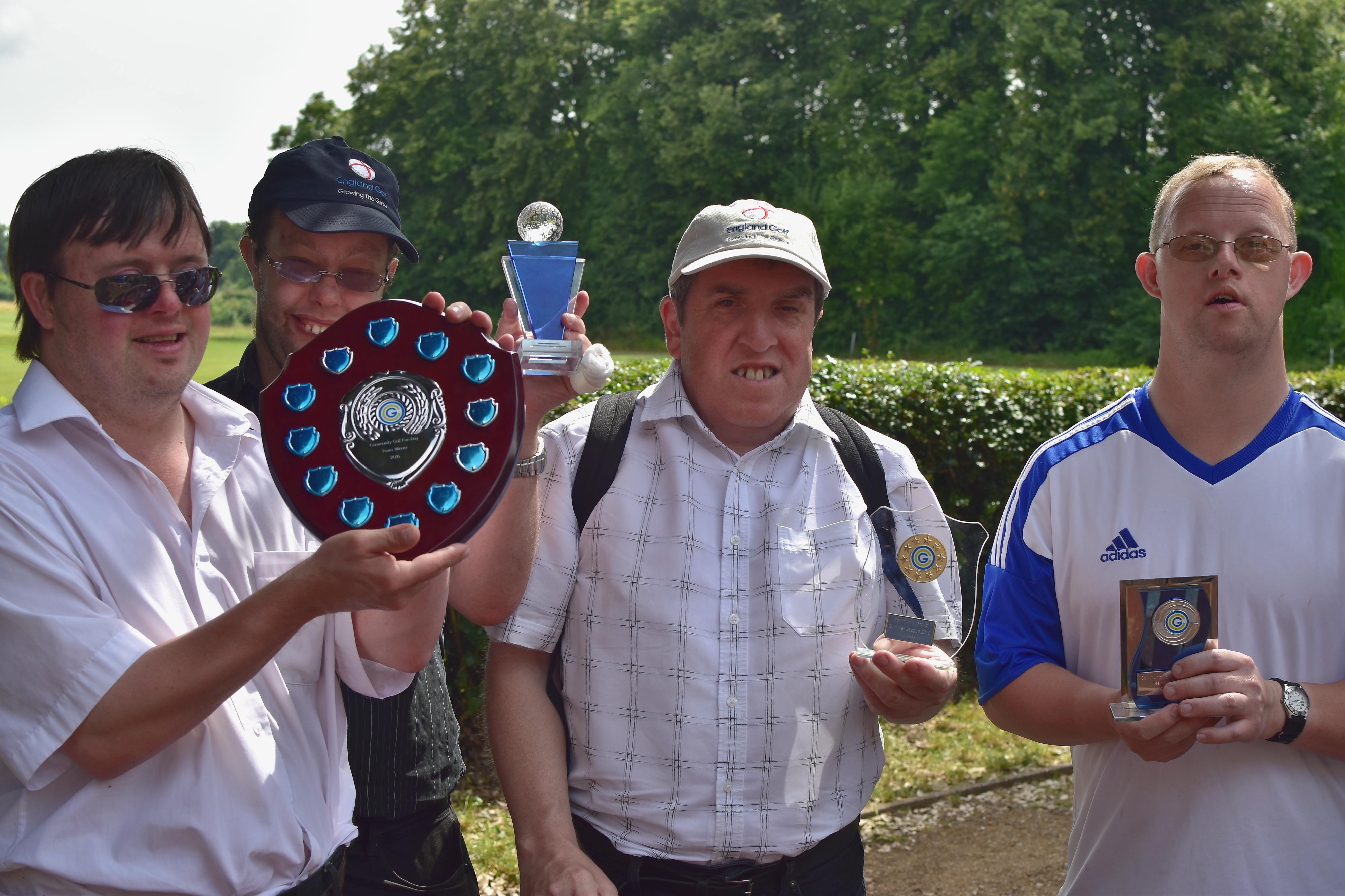 Dorking Community Group Team holding the winning trophy