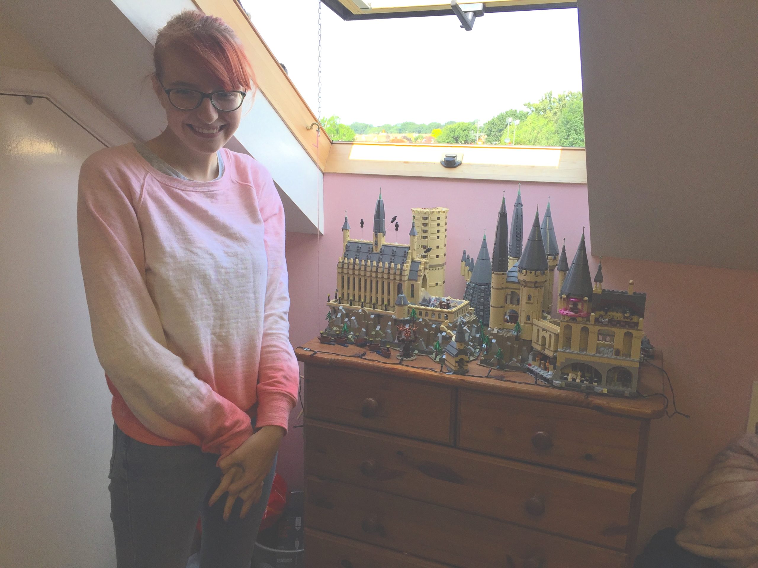 Jenny next to her Harry Potter lego model