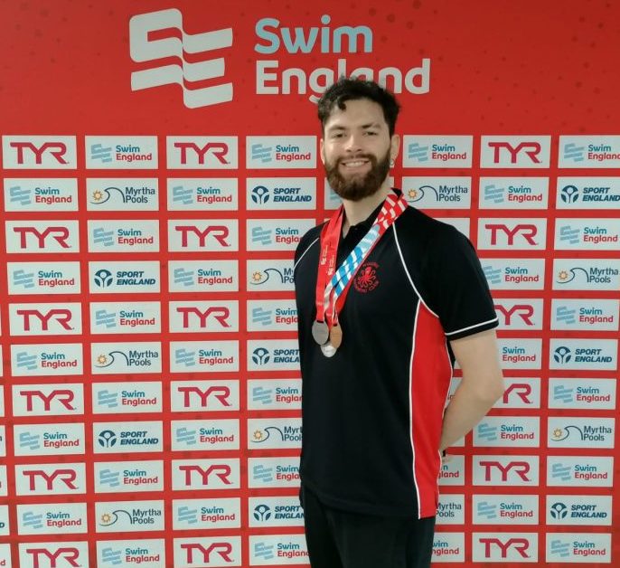 Rubens with his medal at the swimming championships